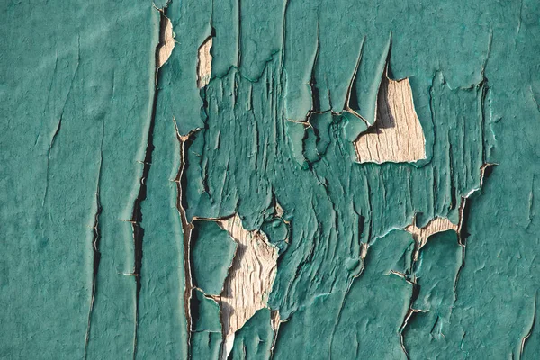 Close up of turquoise wooden fence with cracks and old paint — Stock Photo