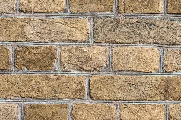 Brown grungy brick wall with sunlight — Stock Photo