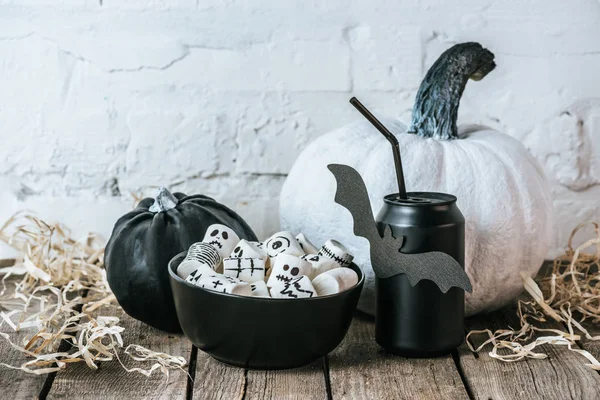 Close-up shot of halloween composition with pumpkins, marshmallows and can of soda — Stock Photo