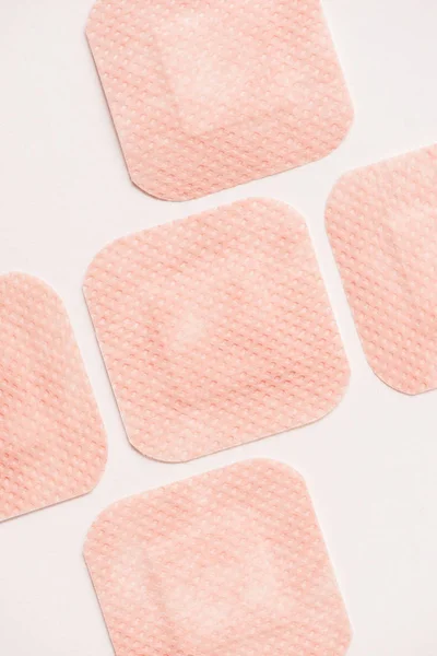 Top view of adhesive bandages on white surface — Stock Photo