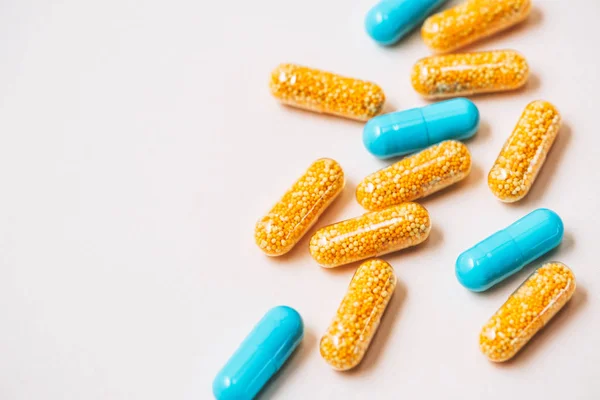 Close-up shot of plastic medical capsules on white — Stock Photo