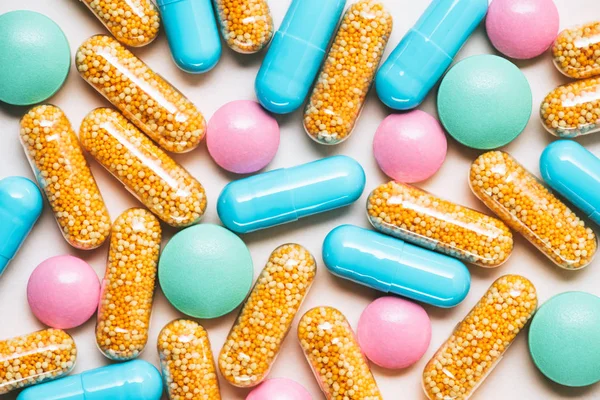 Top view of various colorful pills on white surface — Stock Photo