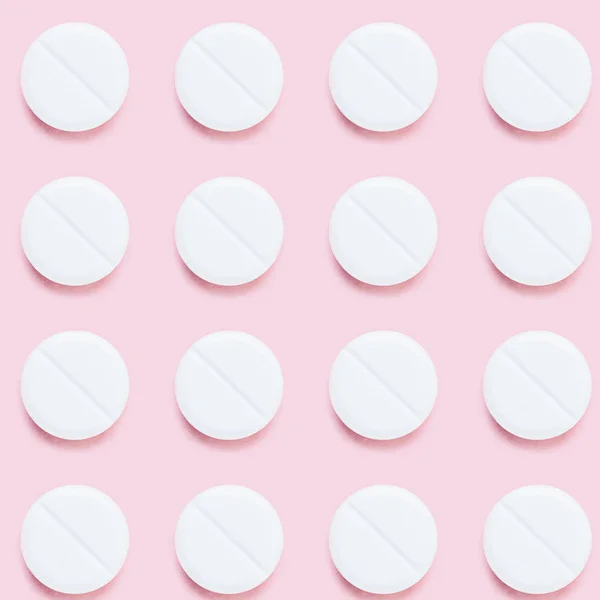 Top view of pattern of medical pills on pink surface — Stock Photo