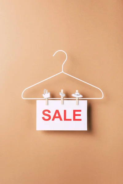 Hanger with sale sign for black friday on beige — Stock Photo
