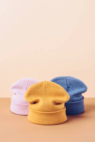 Three casual autumn hats on beige — Stock Photo