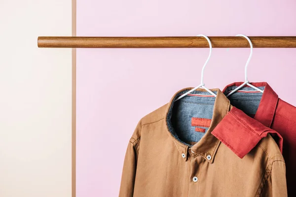 Closeup of trendy shirts on hangers, fashion industry — Stock Photo