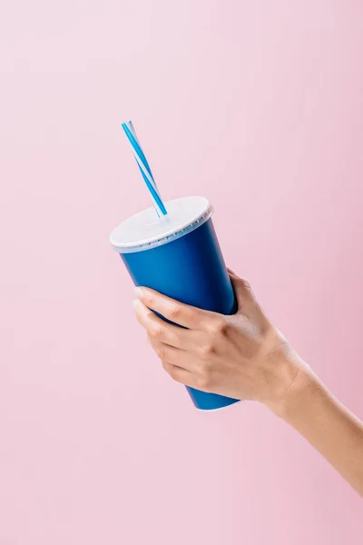 Cropped shot of woman holding paper cup with drink isolated on pink — Stock Photo