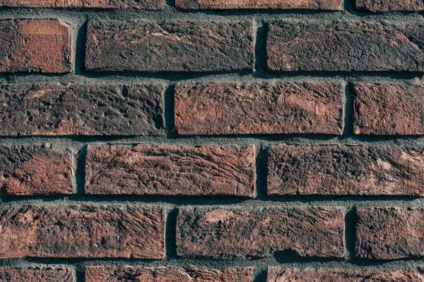 Primo piano del muro di mattoni marrone scuro — Foto stock