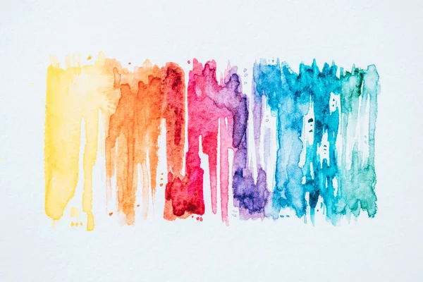 Abstract colorful watercolor strokes on white paper texture — Stock Photo