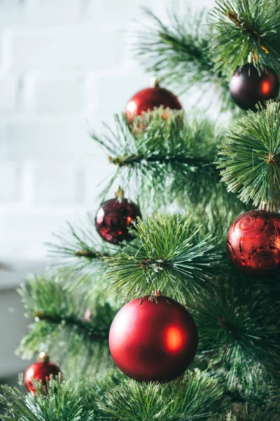 Close up view of red christmas balls on Christmas tree — Stock Photo