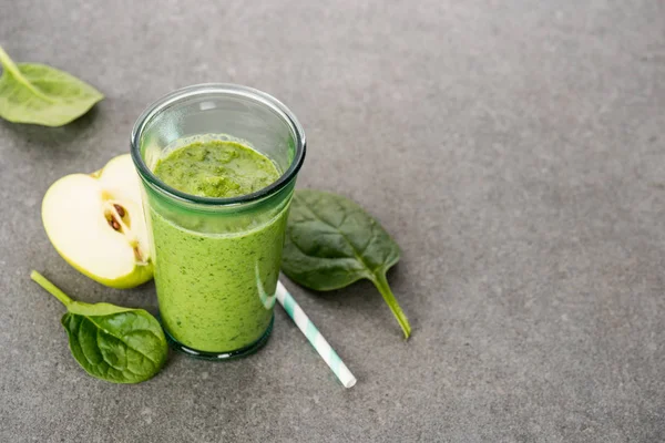Half apple and healthy organic smoothie in glass — Stock Photo