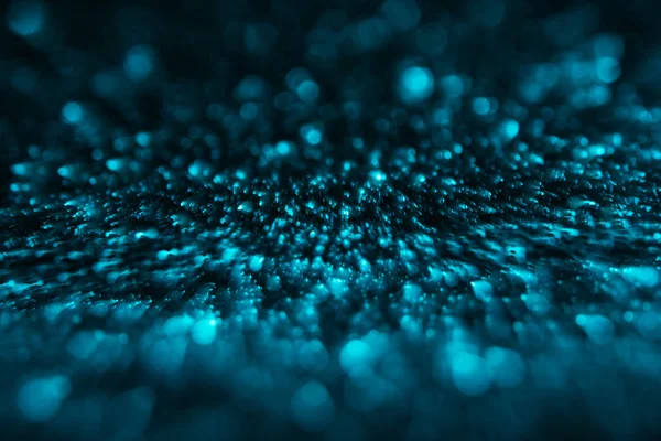 Abstract defocused background with turquoise glitter — Stock Photo