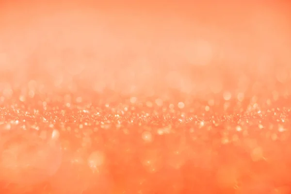 Abstract orange background with shiny glitter — Stock Photo
