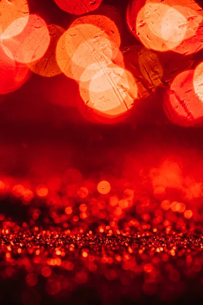 Abstract christmas background with red glitter and bokeh — Stock Photo