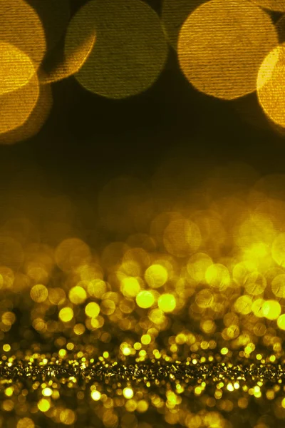 Christmas sparking background with golden glitter and bokeh — Stock Photo