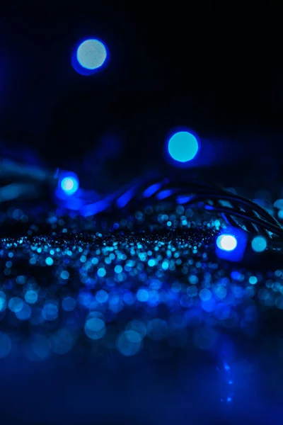 Abstrakte leuchtende Textur mit blauem Glitzern und Bokeh — Stockfoto
