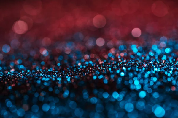 Glowing background with pink and turquoise blurred glitter — Stock Photo