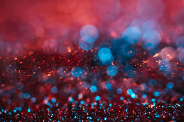 Christmas background with pink and turquoise blurred glitter — Stock Photo