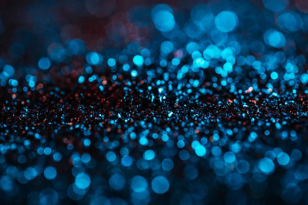 Christmas background with turquoise blurred glitter — Stock Photo