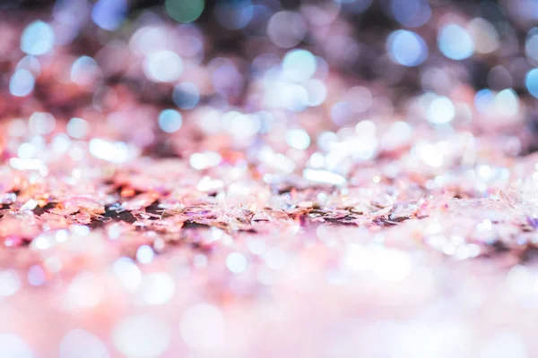 Sfondo lucido con brillantini rosa chiaro e bokeh — Foto stock