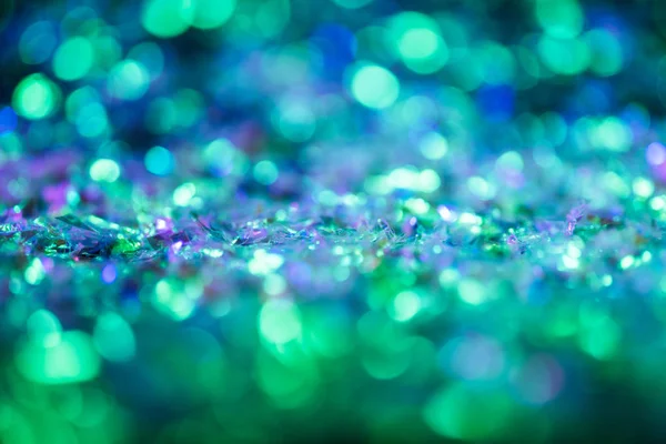 Abstrakt leuchtender Hintergrund mit grünem und blauem Glitzern — Stock Photo