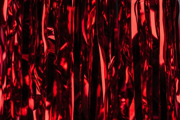 Celebration red shiny serpentine as christmas background — Stock Photo