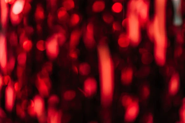 Dark red blurred streamers as christmas background — Stock Photo