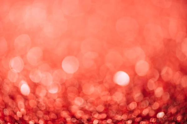 Abstract red christmas background with blurred glitter — Stock Photo