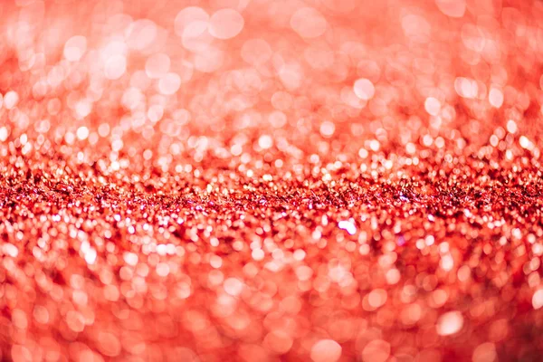 New year background with red defocused glitter — Stock Photo