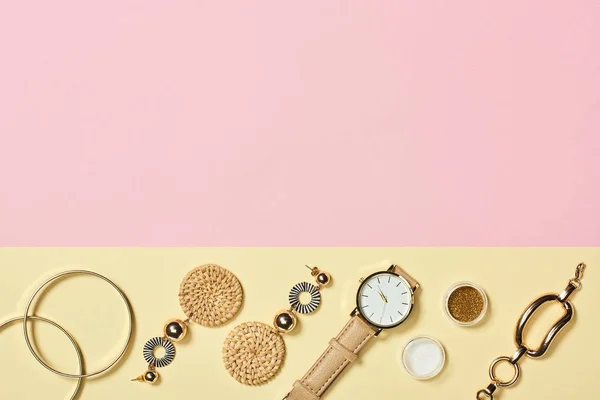 Top view of earrings, eyeshadow, bracelets and watch — Stock Photo