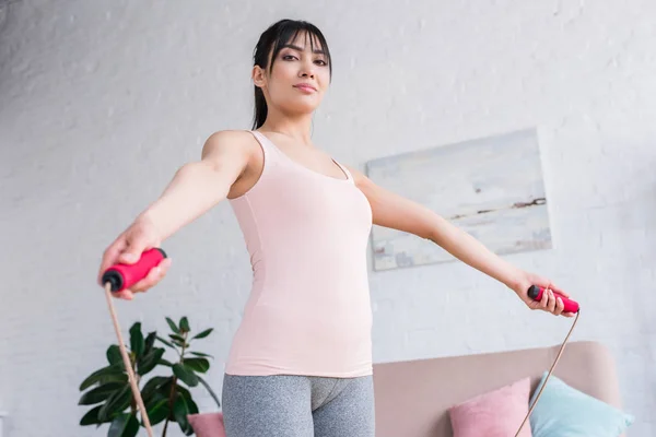 Attractive Fit Woman Working Out Jumping Rope Home — Stock Photo, Image