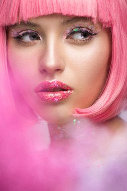 attractive woman with pink hair and makeup with glitter looking away clipart