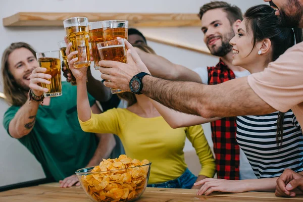 Happy Group Multicultural Friends Clinking Beer Bottles Watching Soccer Match — Stock Photo, Image