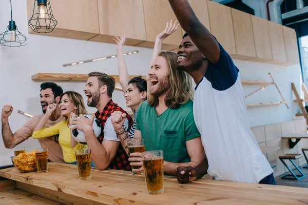 Excited Multicultural Friends Celebrating Gesturing Hands Watching Football Match Bar — Stock Photo, Image