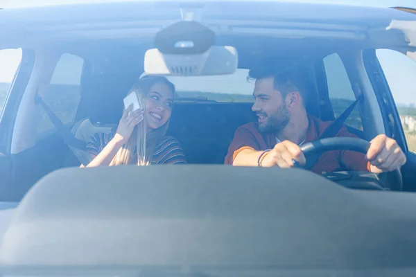 Front View Smiling Woman Talking Smartphone Looking Boyfriend Driving Car — Stock Photo, Image