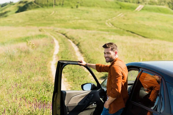 Young Smiling Man Standing Car Rural Meadow — Stock Photo, Image