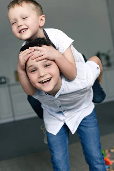 Portrait Happy Brothers Piggybacking Together Home — Stock Photo, Image