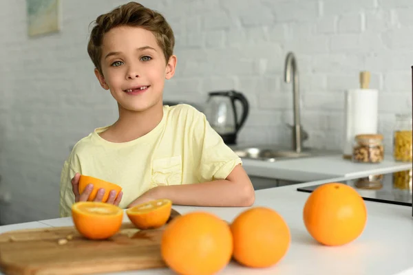 Portrait Little Boy Standing Counter Fresh Oranges Kitchen Home — Stock Photo, Image