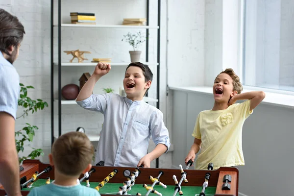 Father Happy Little Sons Playing Table Football Together Home — Stock Photo, Image