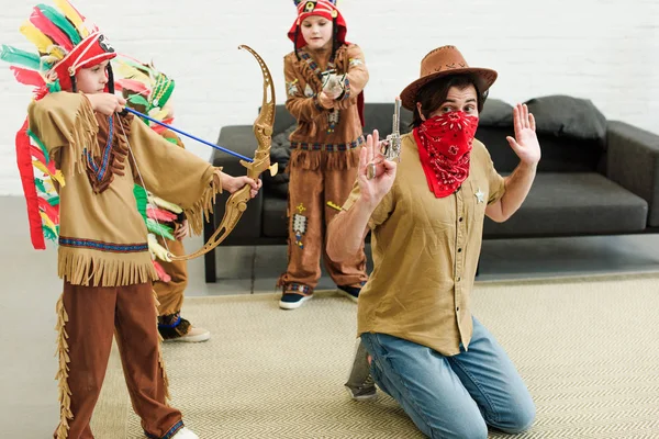 Father Hat Bandana Little Sons Indigenous Costumes Toys Playing Together — Stock Photo, Image