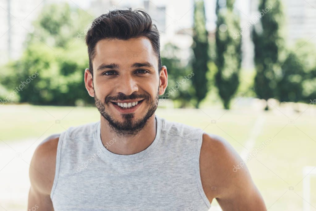 close-up shot of smiling young man looking at camera