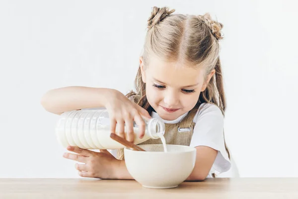 Happy Little Schoolgirl Pouring Milk Cereal Breakfast Isolated White — Stock Photo, Image