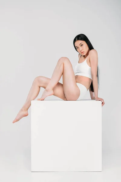 Attractive Asian Girl Lingerie Sitting White Cube Isolated Grey — Free Stock Photo