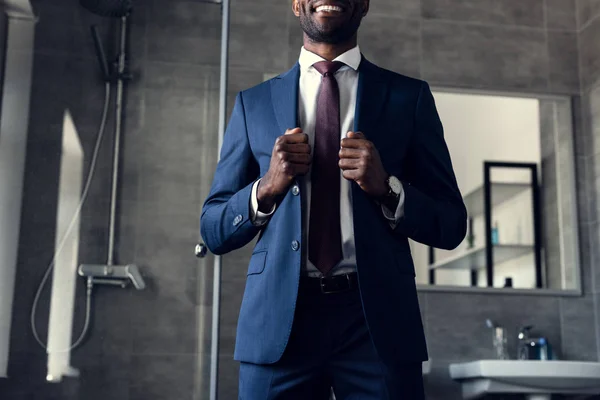 Cropped Shot Smiling Young Businessman Stylish Suit Standing Bathroom — Stock Photo, Image