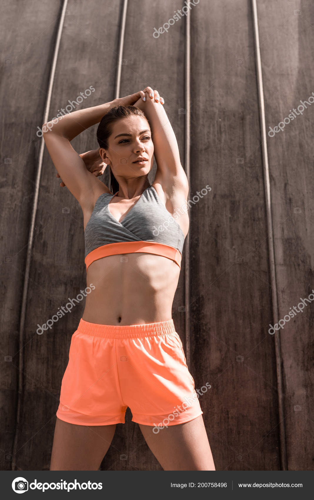 Beautiful Athletic Woman Sportswear Stretching Arms Stock Photo by  ©AllaSerebrina 200758496