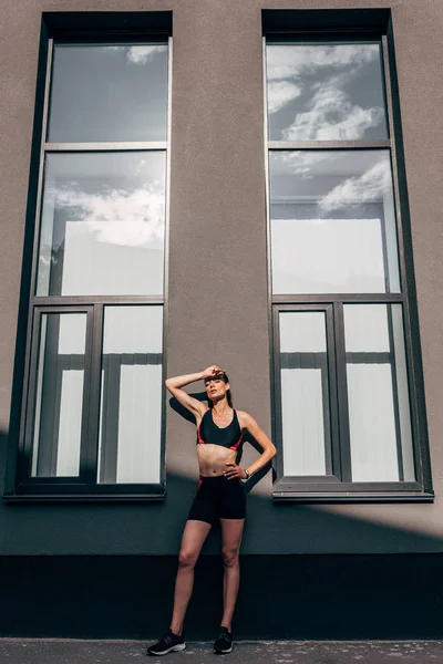 Young Tired Sportswoman Standing Building Two Big Windows — Stock Photo, Image