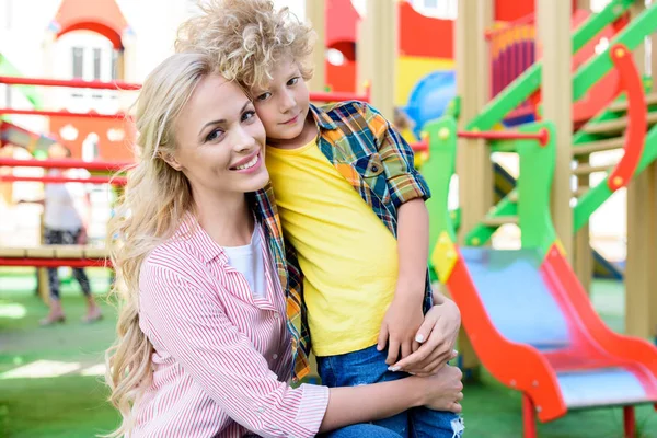 Selective Focus Happy Mother Embracing Curly Little Son Playground — Stock Photo, Image
