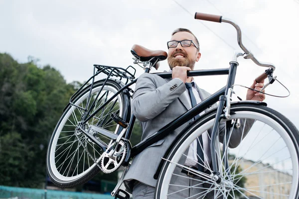 Smiling Bearded Businessman Grey Suit Holding Bike — Free Stock Photo