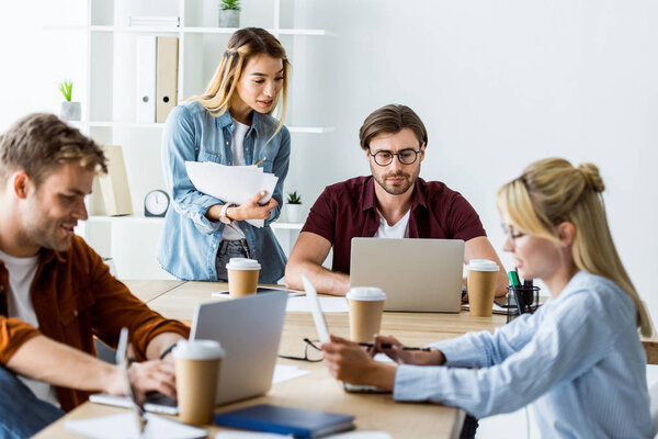 multicultural colleagues working on startup project in office at meeting