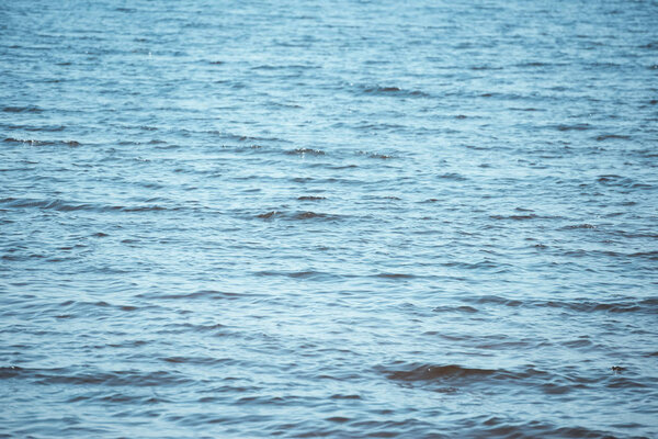 full frame image of wavy blue sea background 